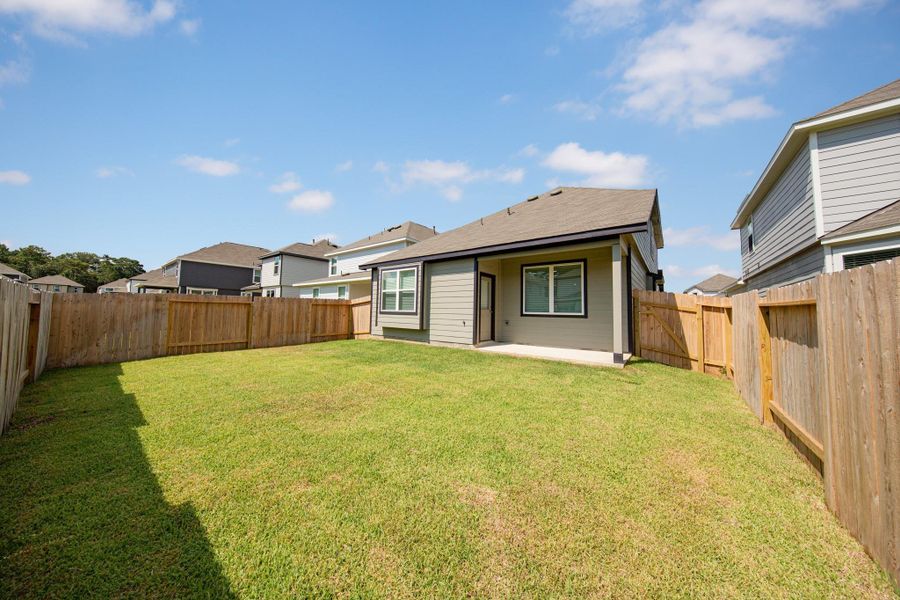 Exterior details and patio area of a home in River's Edge, Conroe (Image 1). Exterior details and patio area of a home in River's Edge, Conroe (Image 1).
