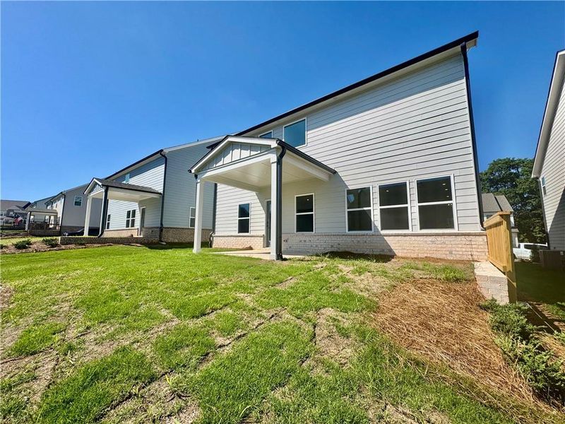 Exterior details and patio area of a home in Eastlyn Crossing, Flowery Branch (Image 3).