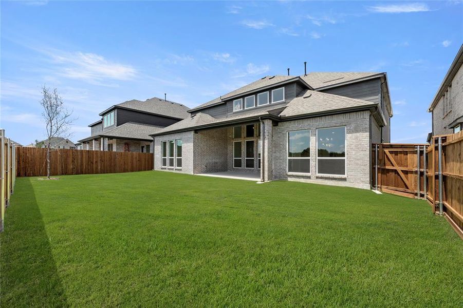 Front exterior of a new home in Valencia on The Lake, Little Elm, TX, highlighting curb appeal (Image 17).