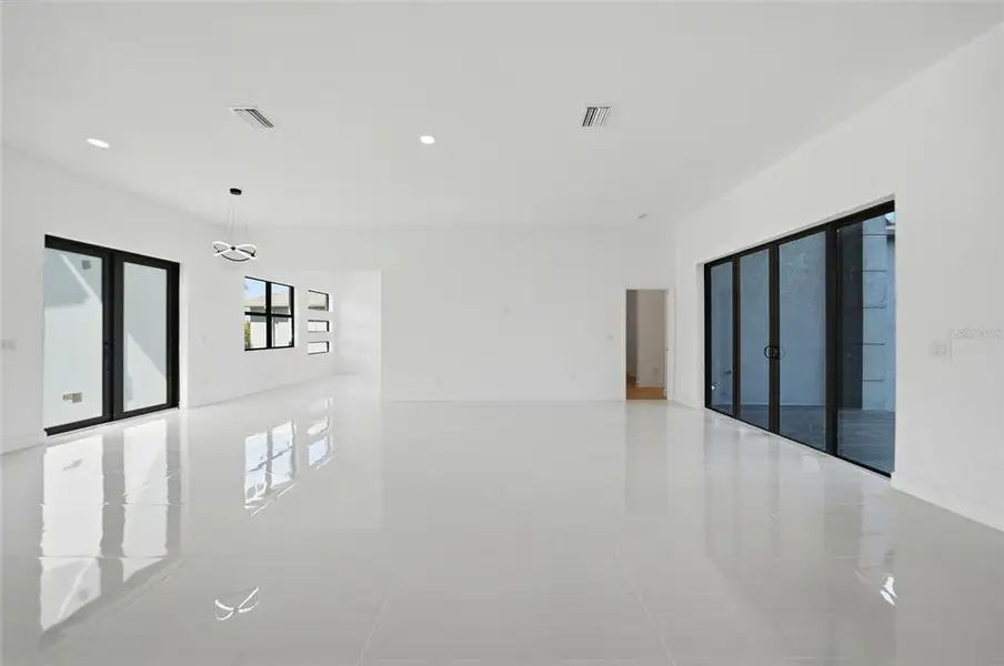 Spacious, unfurnished interior of a new home in , Port Charlotte (Image 36).