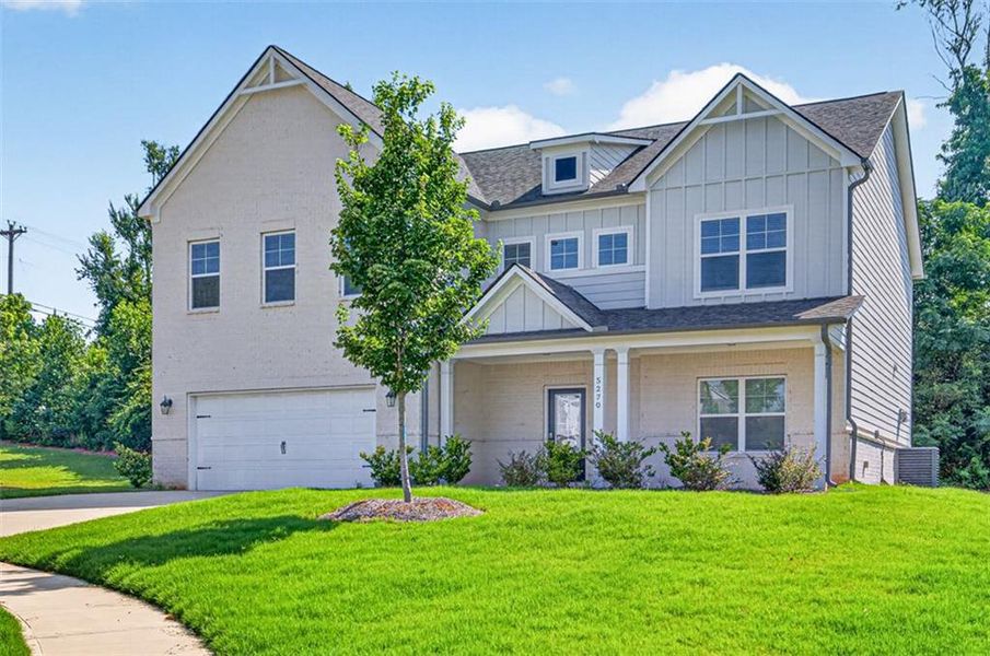 Front exterior of a new home in Overlook at Hamilton Mill, Auburn, GA, highlighting curb appeal (Image 23).