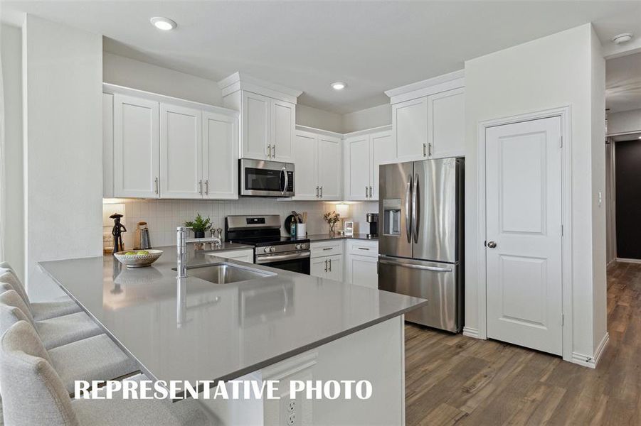 With an abundance of style, counter space and storage, you can find the kitchen of your dreams in Heritage Village!  REPRESENTATIVE PHOTO OF MODEL HOME.