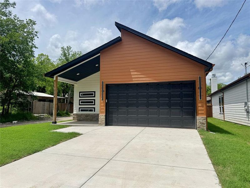 Front exterior of a new home in , Greenville, TX, highlighting curb appeal (Image 17).