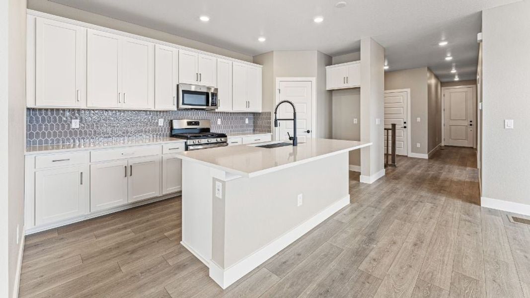 Representative furnished interior of a home built from the Pike by Taylor Morrison in The Aurora Highlands Town Collection, Aurora (Image 5).