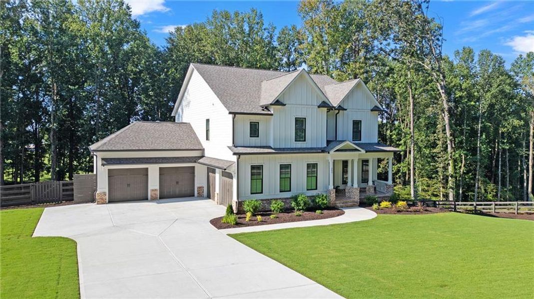 Front exterior of a new home in , Woodstock, GA, highlighting curb appeal (Image 1). Front exterior of a new home in , Woodstock, GA, highlighting curb appeal (Image 1).
