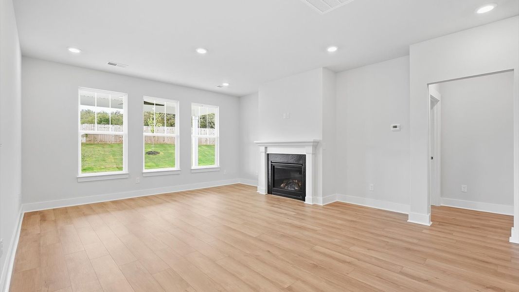 First-rate living space with tasteful hardwood floors and a functional open-concept design at Woodglen