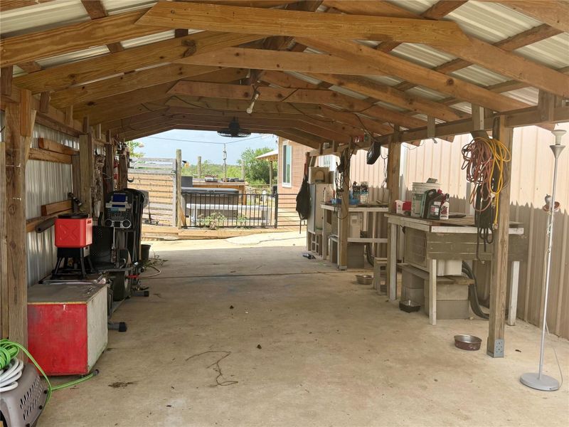 A robust shed offers ample covered workspace with a clear view of the surrounding landscape.