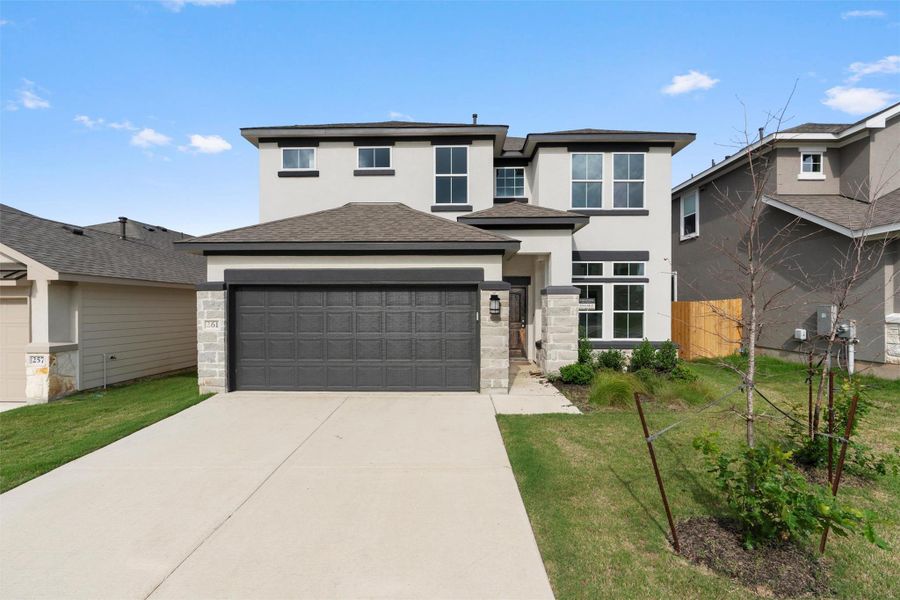 Front exterior of a new home in Butler Farms, Liberty Hill, TX, highlighting curb appeal (Image 1). Front exterior of a new home in Butler Farms, Liberty Hill, TX, highlighting curb appeal (Image 1).