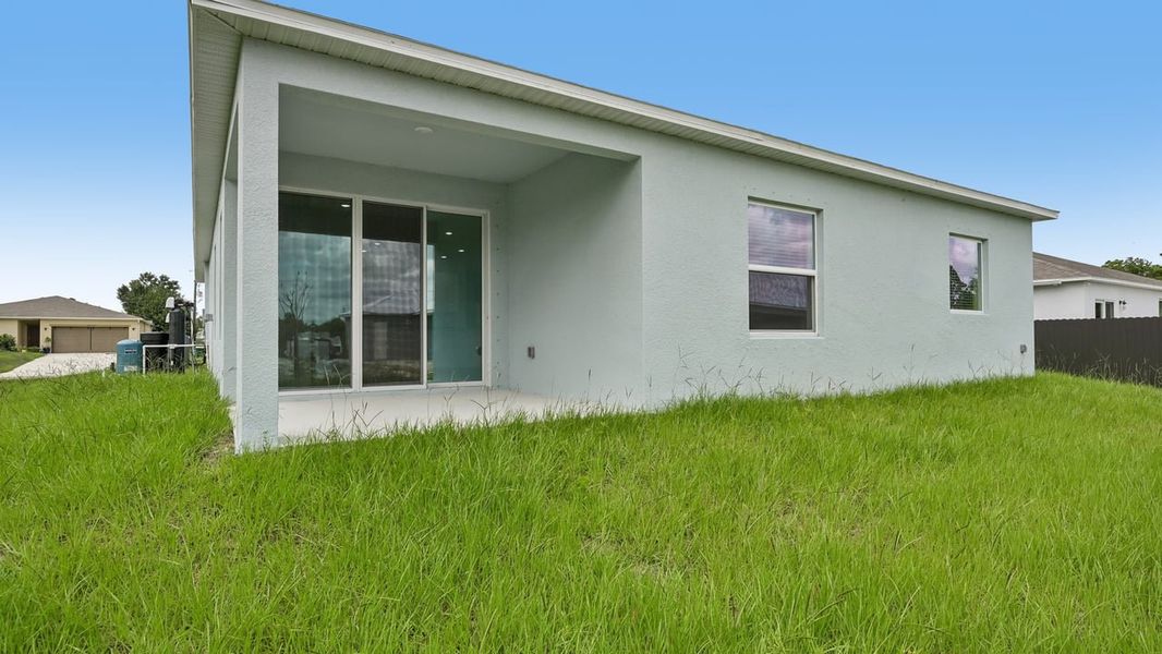 Exterior details and patio area of a home in Port Charlotte, Port Charlotte (Image 3).