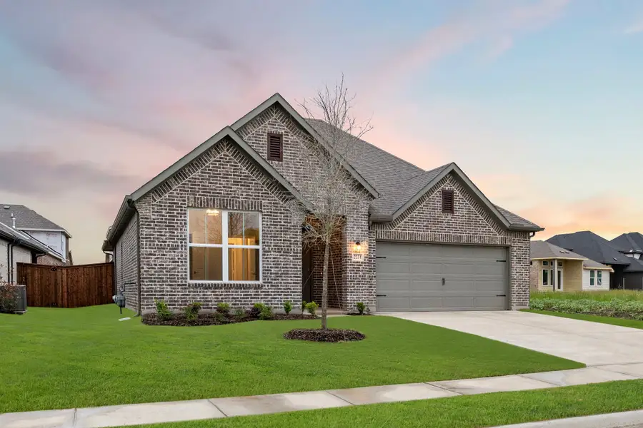 Representative exterior photo of a completed home built from the Glory by Rockwell Homes in Creekside, Royse City, TX (Image 1). Representative exterior photo of a completed home built from the Glory by Rockwell Homes in Creekside, Royse City, TX (Image 1).