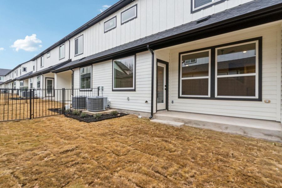 Exterior details and patio area of a home in Townhomes at Gattis, Round Rock (Image 21).
