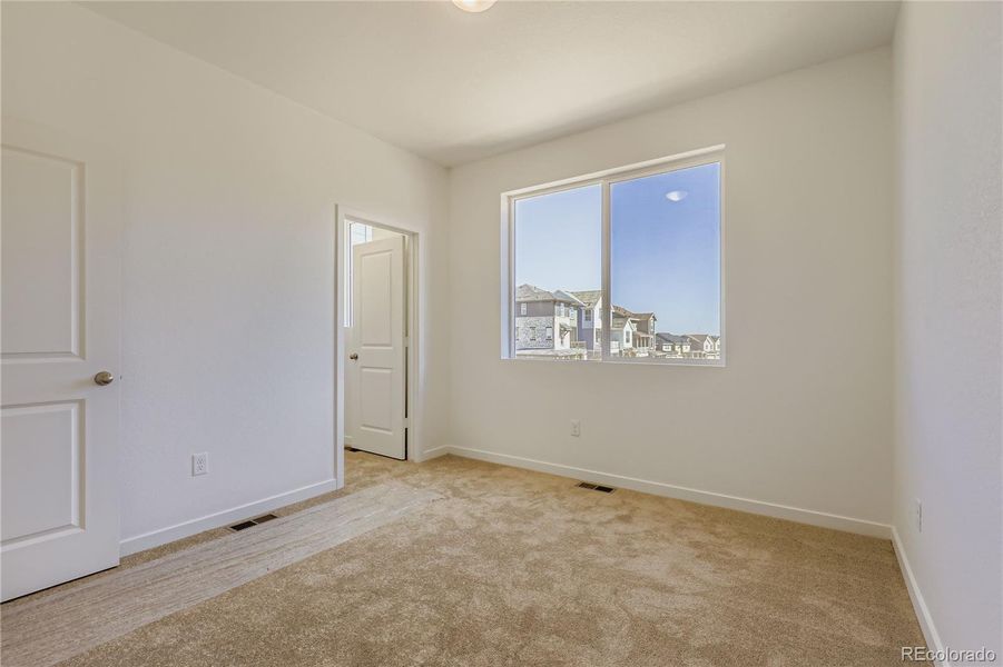 Spacious, unfurnished interior of a new home in Parterre: The Parkside Collection, Thornton (Image 11).