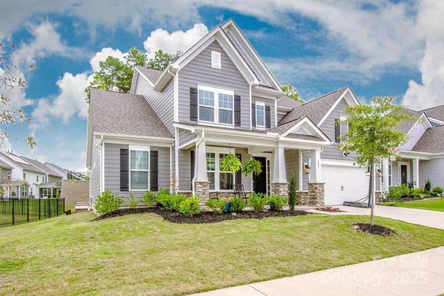 Front exterior of a new home in Signature at Reid's Cove, Mooresville, NC, highlighting curb appeal (Image 21).