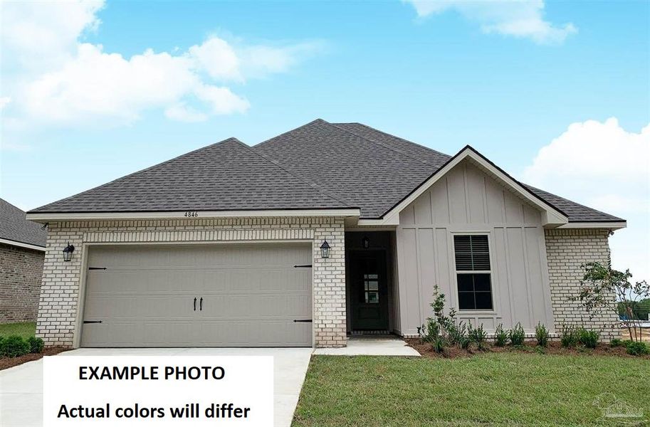 Front exterior of a new home in Sentinel Ridge, Pace, FL, highlighting curb appeal (Image 2). Front exterior of a new home in Sentinel Ridge, Pace, FL, highlighting curb appeal (Image 2).