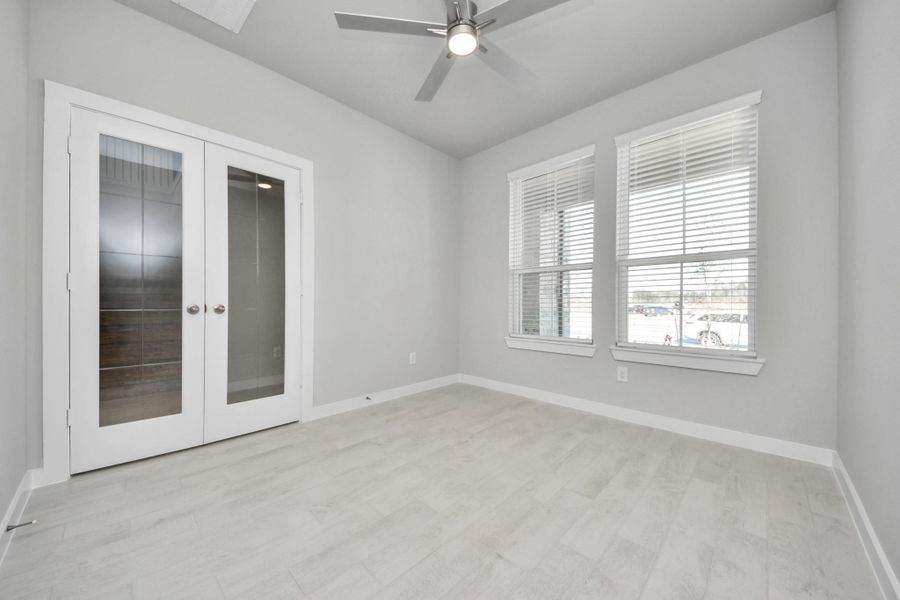 Step into the inviting home office, where elegant tile flooring adds a touch of freshness and comfort to the workspace. Natural light pours through the window, creating an inspiring environment for productivity and focus. Sample photo of completed home with similar floor plan. Actual colors and selections may vary. Step into the inviting home office, where elegant tile flooring adds a touch of freshness and comfort to the workspace. Natural light pours through the window, creating an inspiring environment for productivity and focus. Sample photo of completed home with similar floor plan. Actual colors and selections may vary.