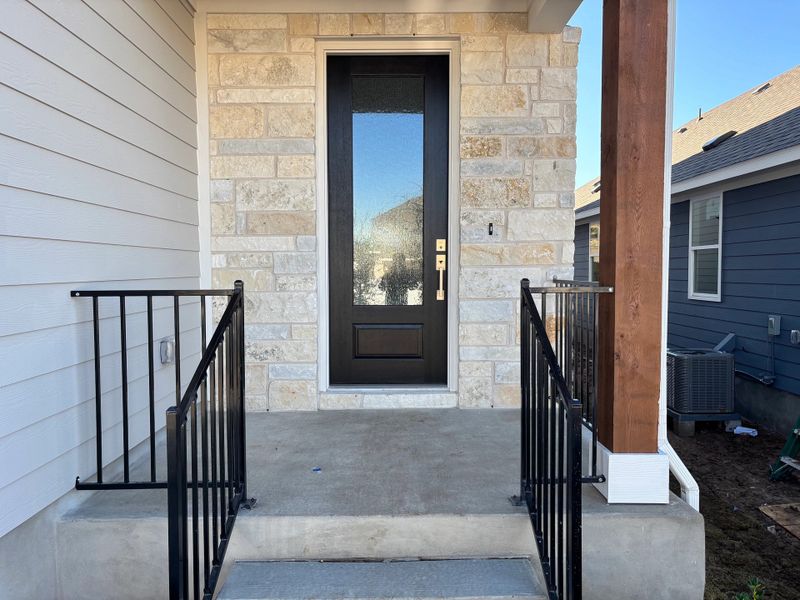 Exterior details and patio area of a home in Cannon Ranch 40s, Dripping Springs (Image 3).