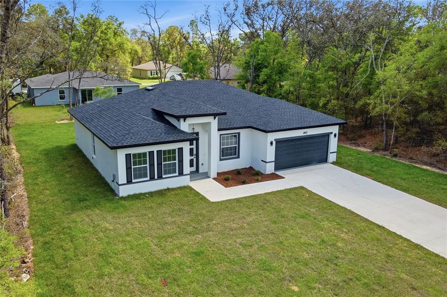 Front exterior of a new home in , Citrus Springs, FL, highlighting curb appeal (Image 16).