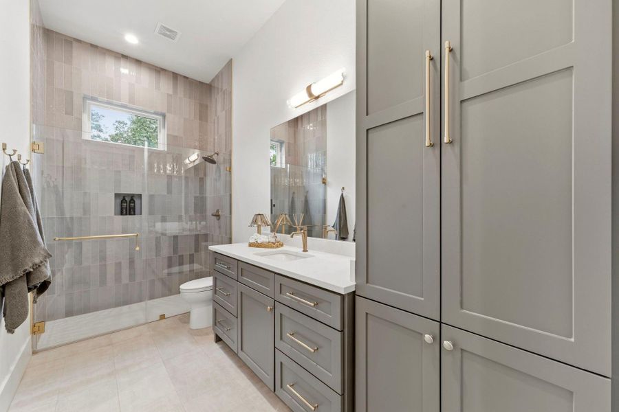 Impressive guest suite bath with ample cabinet storage. Impressive guest suite bath with ample cabinet storage.
