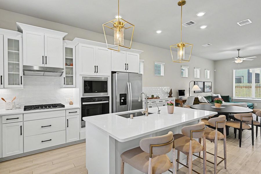 Stainless steel appliances and crisp white cabinetry add a sleek, contemporary touch to the kitchen. Stainless steel appliances and crisp white cabinetry add a sleek, contemporary touch to the kitchen.