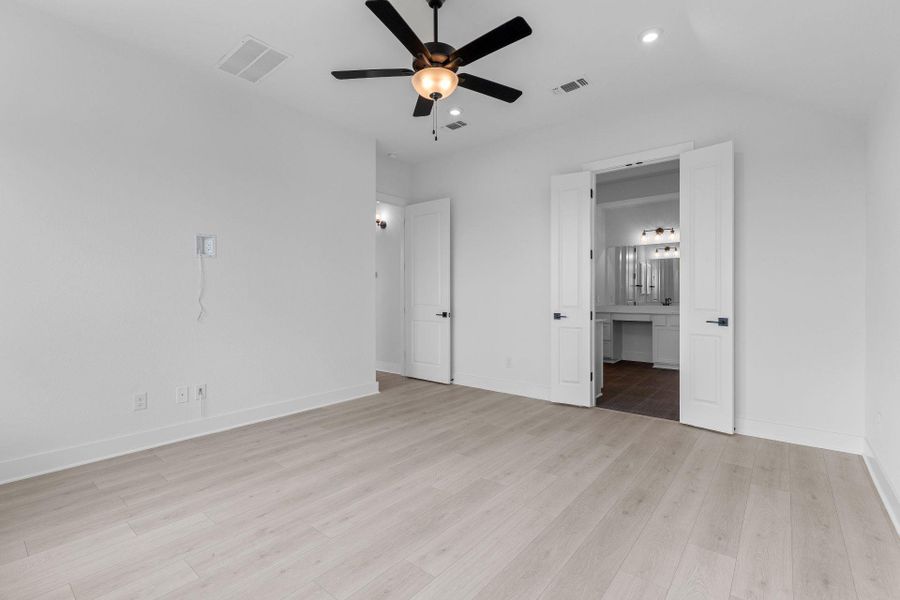 Primary Bedroom with elevated ceiling
