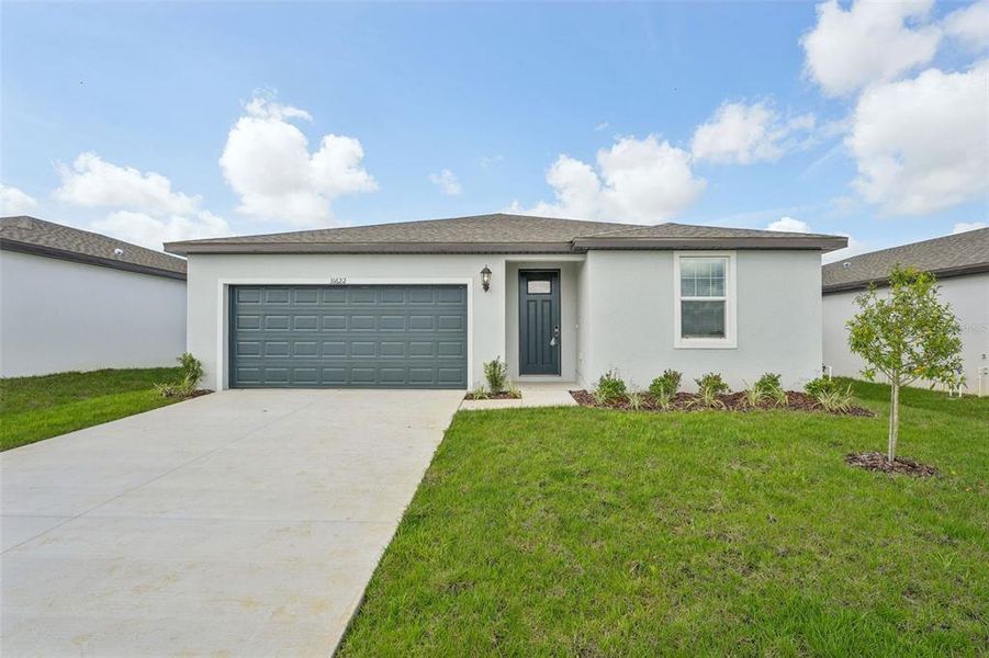 Front exterior of a new home in , Brooksville, FL, highlighting curb appeal (Image 2).