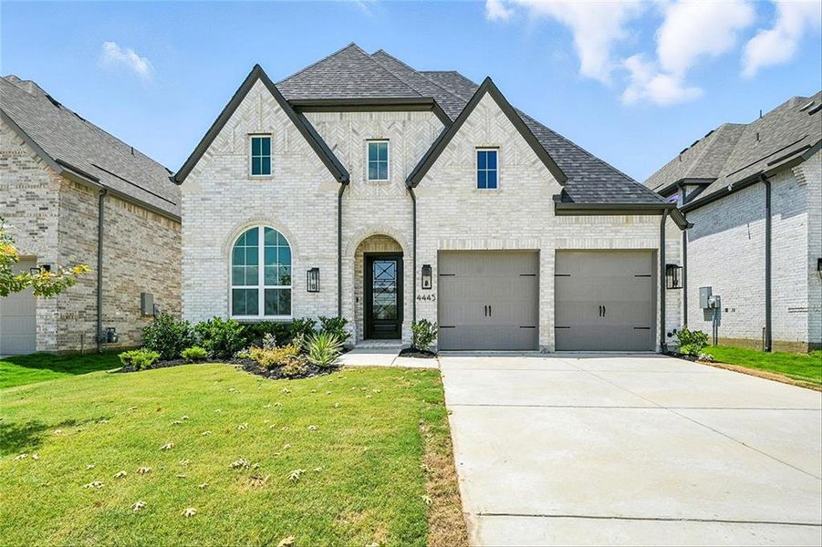 Front exterior of a new home in Mosaic: Classic Series - 50ft. Lots, Celina, TX, highlighting curb appeal (Image 17).