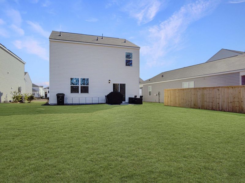 Exterior details and patio area of a home in Pine Hills at Cane Bay, Summerville (Image 3). Exterior details and patio area of a home in Pine Hills at Cane Bay, Summerville (Image 3).