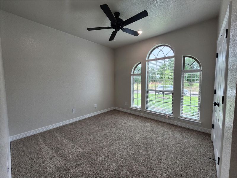 Arched windows bathe this room in natural light, complementing the vaulted ceilings and inviting atmosphere. Arched windows bathe this room in natural light, complementing the vaulted ceilings and inviting atmosphere.