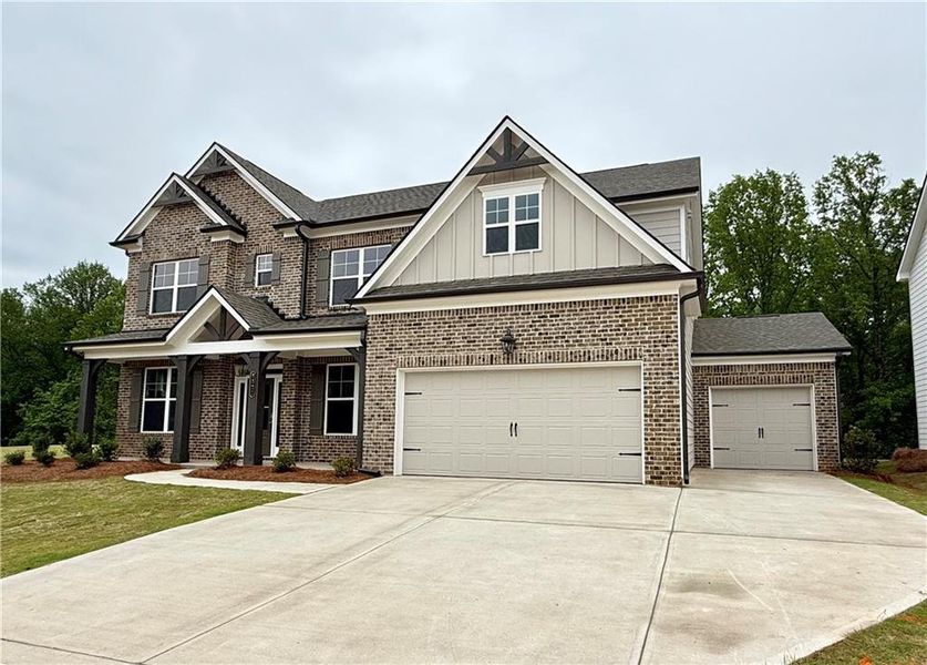 Front exterior of a new home in Ponderosa Farms Reserve, Gainesville, GA, highlighting curb appeal (Image 27).