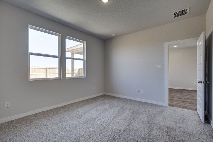 A room with a door and windows.