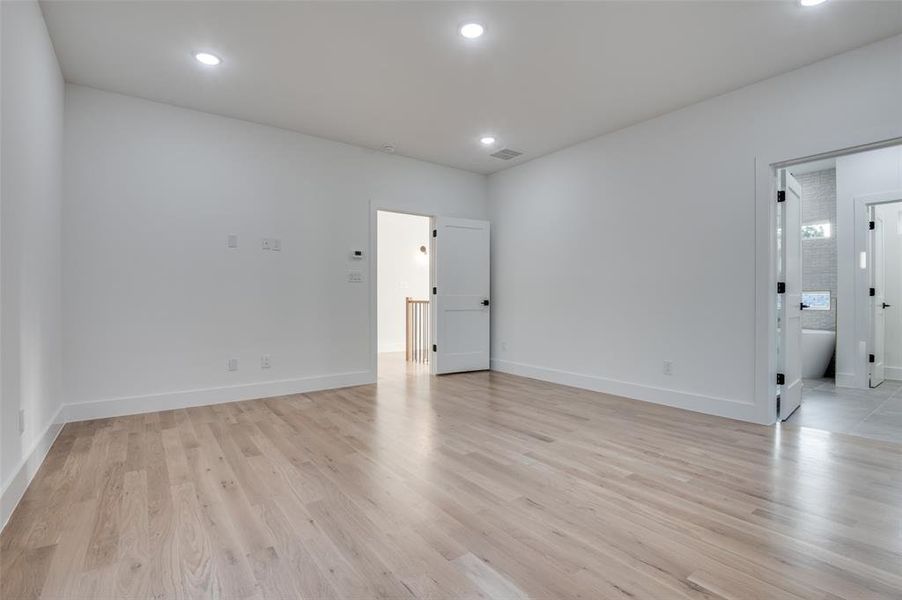 Unfurnished room featuring light wood-style floors and recessed lighting