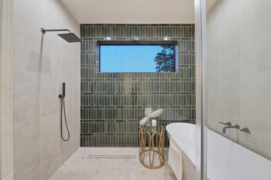 Spa-inspired primary bathroom combines elevated materials, custom cabinetry, and a calming neutral palette.