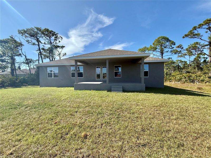 Exterior details and patio area of a home in Rotonda, Rotonda West (Image 15).