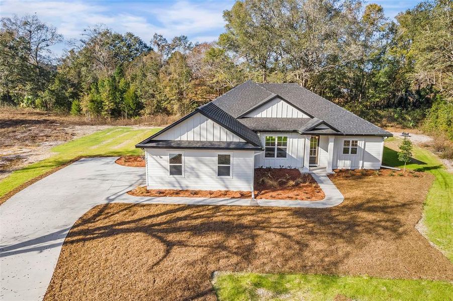 Front exterior of a new home in , Live Oak, FL, highlighting curb appeal (Image 18).