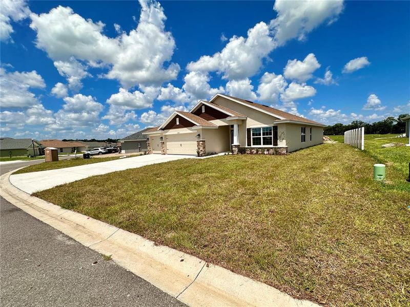 Front exterior of a new home in , Ocala, FL, highlighting curb appeal (Image 16). Front exterior of a new home in , Ocala, FL, highlighting curb appeal (Image 16).