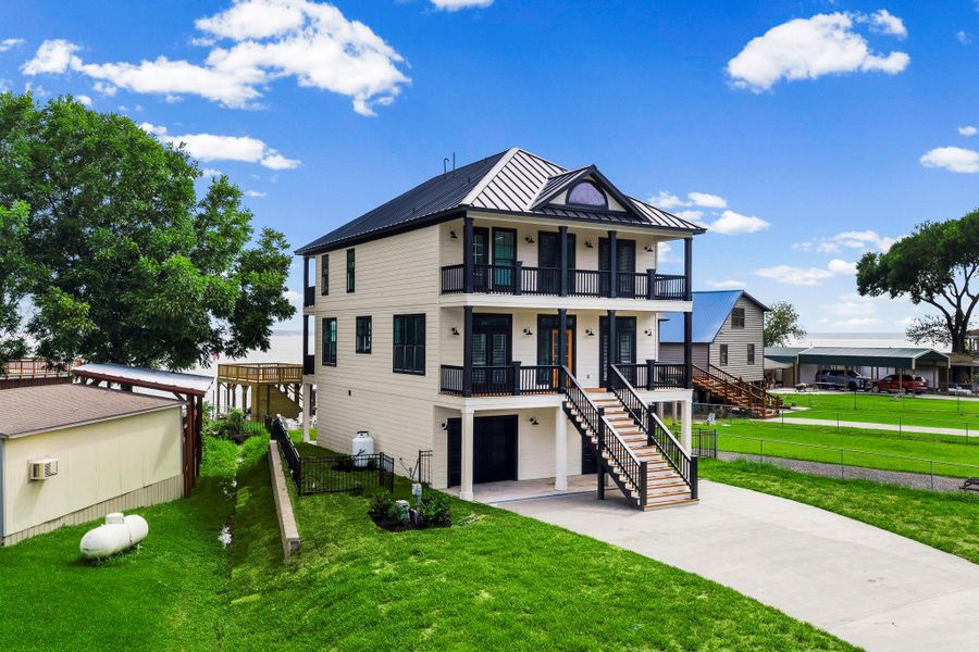 Front exterior of a new home in , Point Blank, TX, highlighting curb appeal (Image 29). Front exterior of a new home in , Point Blank, TX, highlighting curb appeal (Image 29).