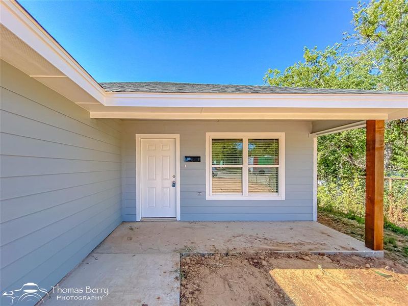 Doorway to property with a patio area Doorway to property with a patio area