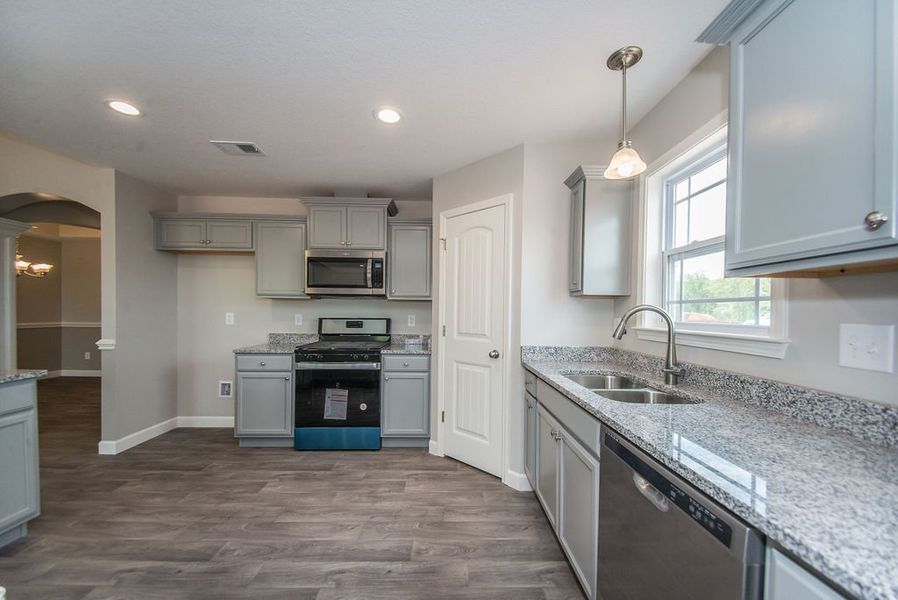 Representative furnished interior of a home built from the Beaumont by Enchanted Homes in Guadalupe Heights, Seguin (Image 14).