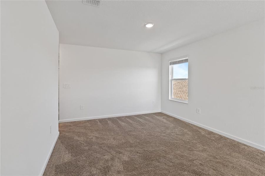 Spacious, unfurnished interior of a new home in Storey Creek: Manor Collection, Kissimmee (Image 36).