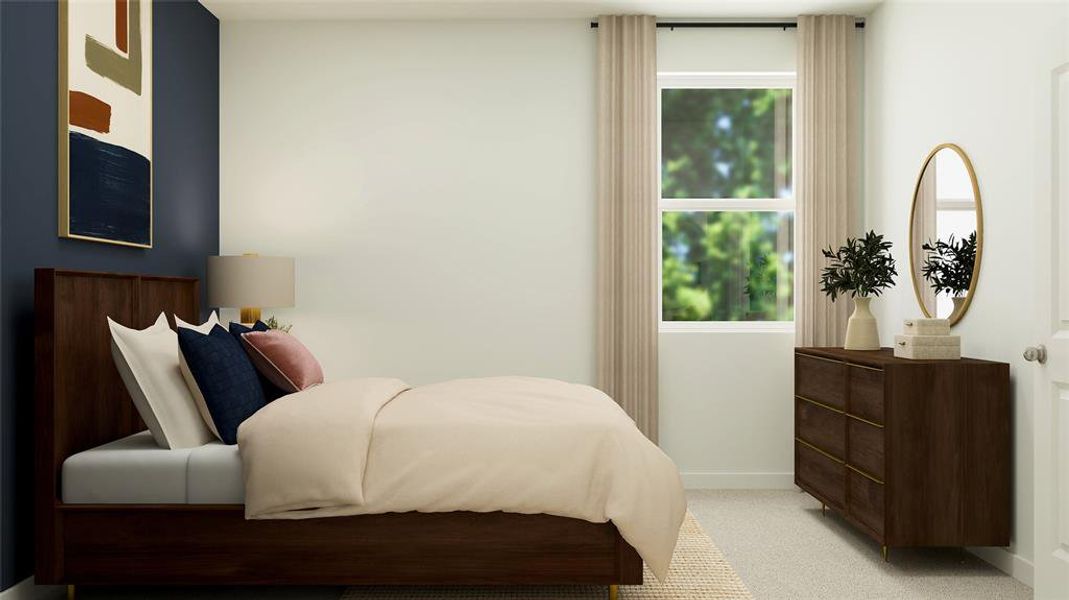 Bedroom featuring light carpet and baseboards