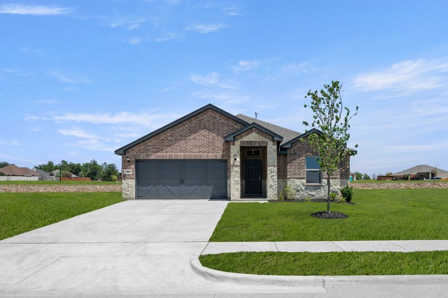 Front exterior of a new home in Baker Farms, Cleburne, TX, highlighting curb appeal (Image 1). Front exterior of a new home in Baker Farms, Cleburne, TX, highlighting curb appeal (Image 1).