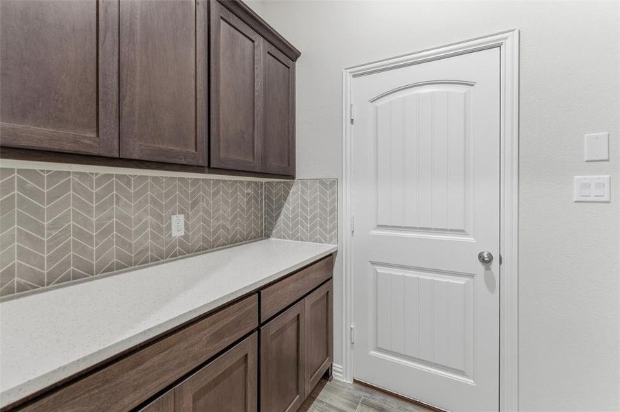 White shaker-style door with a rounded arch detail