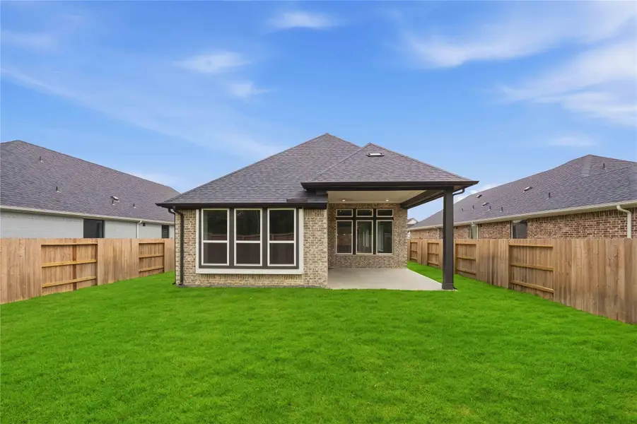 Exterior details and patio area of a home in Ellwood, Iowa Colony (Image 2).