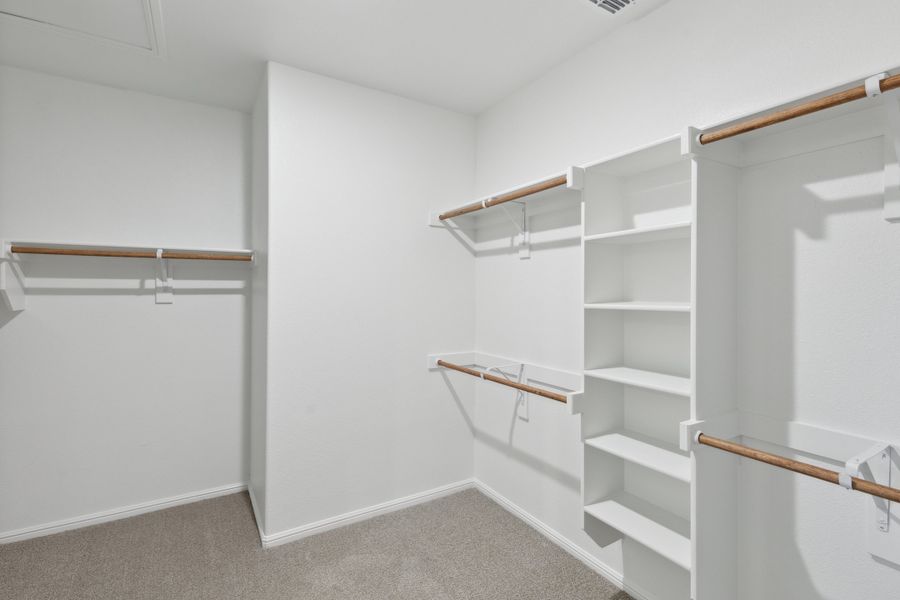 Primary Closet in the Holden home plan by Trophy Signature Homes – REPRESENTATIVE PHOTO Primary Closet in the Holden home plan by Trophy Signature Homes – REPRESENTATIVE PHOTO