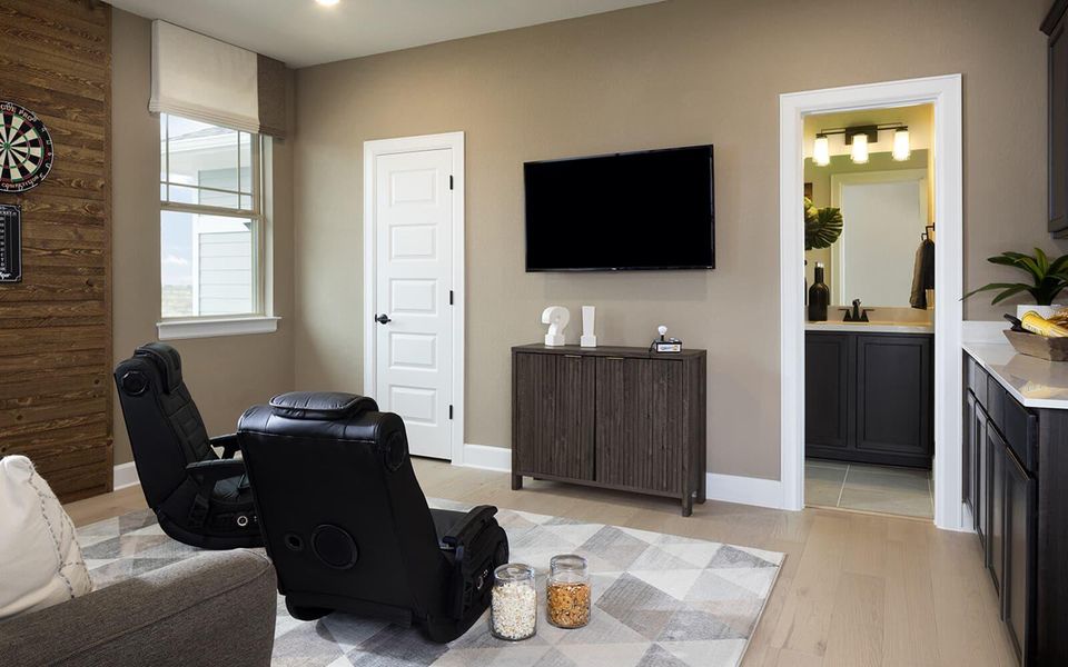 Living room with light wood-type flooring and baseboards Living room with light wood-type flooring and baseboards