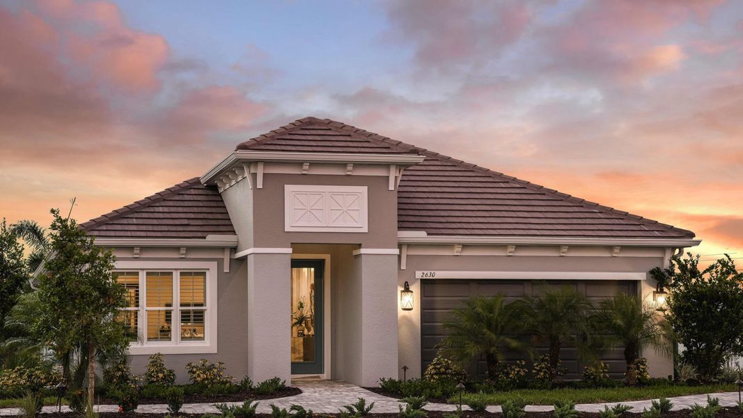 Front exterior of a new home in Windward, Lakewood Ranch, FL, highlighting curb appeal (Image 21). Front exterior of a new home in Windward, Lakewood Ranch, FL, highlighting curb appeal (Image 21).