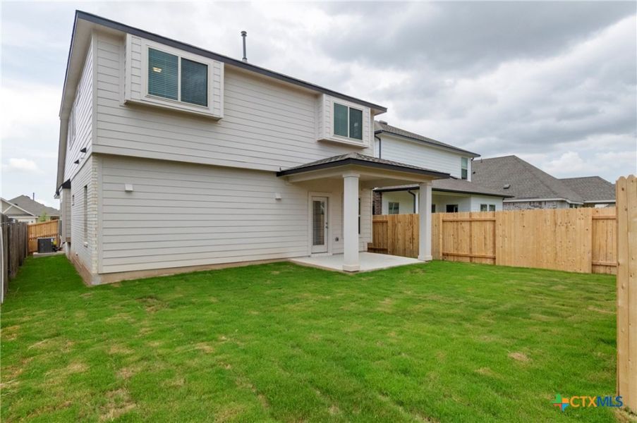 Exterior details and patio area of a home in Crosswinds, Kyle (Image 25).