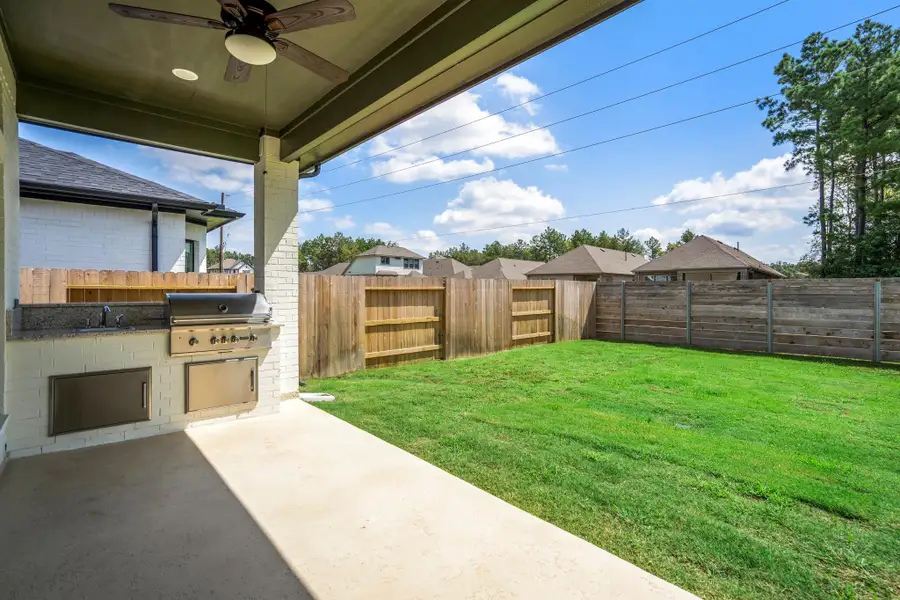 Exterior details and patio area of a home in ARTAVIA, Conroe (Image 25).