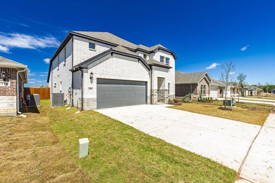 Front exterior of a new home in Stratton Place, Greenville, TX, highlighting curb appeal (Image 15). Front exterior of a new home in Stratton Place, Greenville, TX, highlighting curb appeal (Image 15).