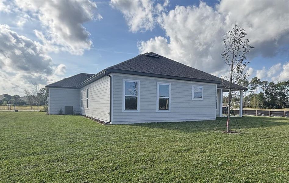 Exterior details and patio area of a home in Ardisia Park Estate, New Smyrna Beach (Image 28).